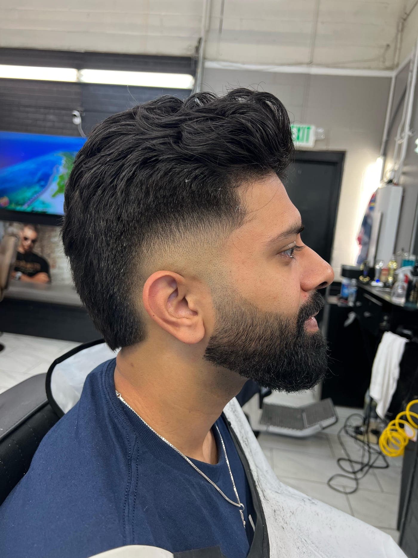Blowout taper haircut and shaped beard by The Fade Crew